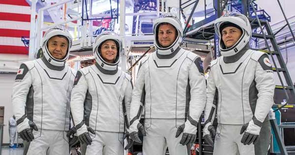 Josh Cassada ’00 (PhD) (second from left) and SpaceX astronauts Anna Kikina, Nicole Mann, and Koichi Wakata suited up to test equipment at SpaceX headquarters in California in the days leading up to their October mission to the International Space Station.